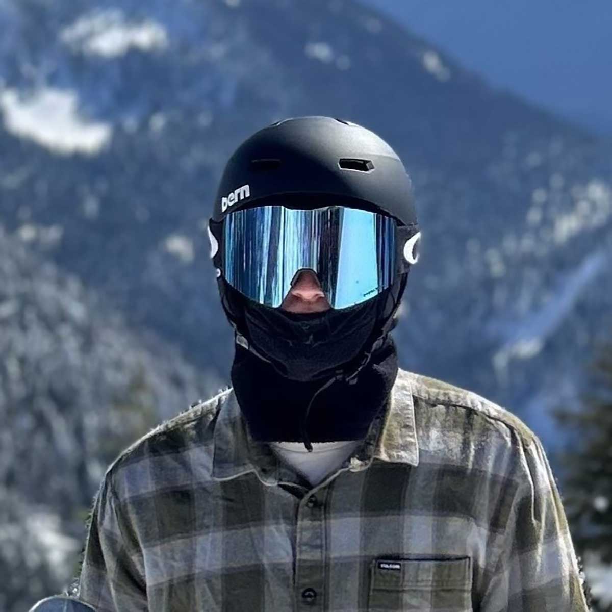 snowboarder with bern helmate and oakley snowboard goggles