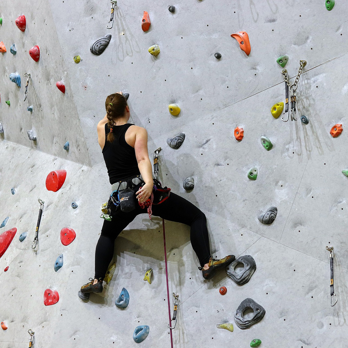 lead rock climbing at an indoor gym