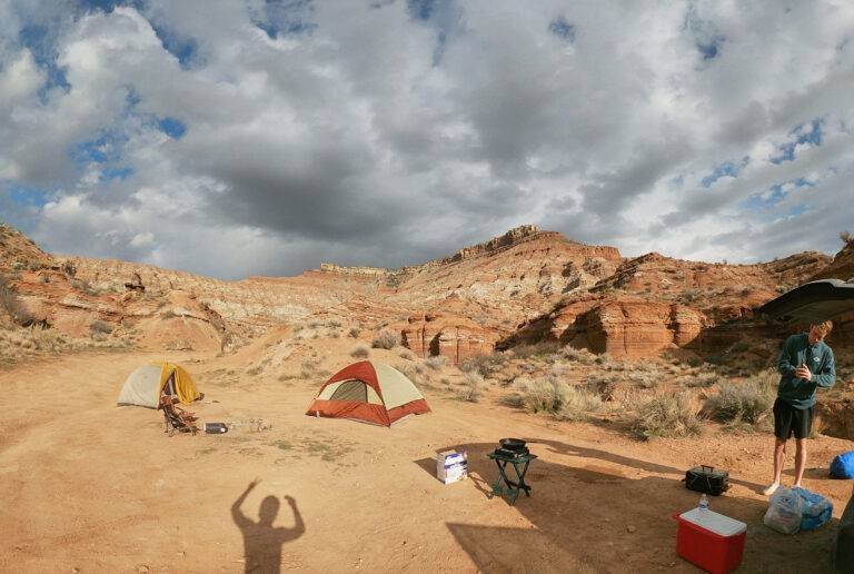 Tent campsite in a red rock desert canyon